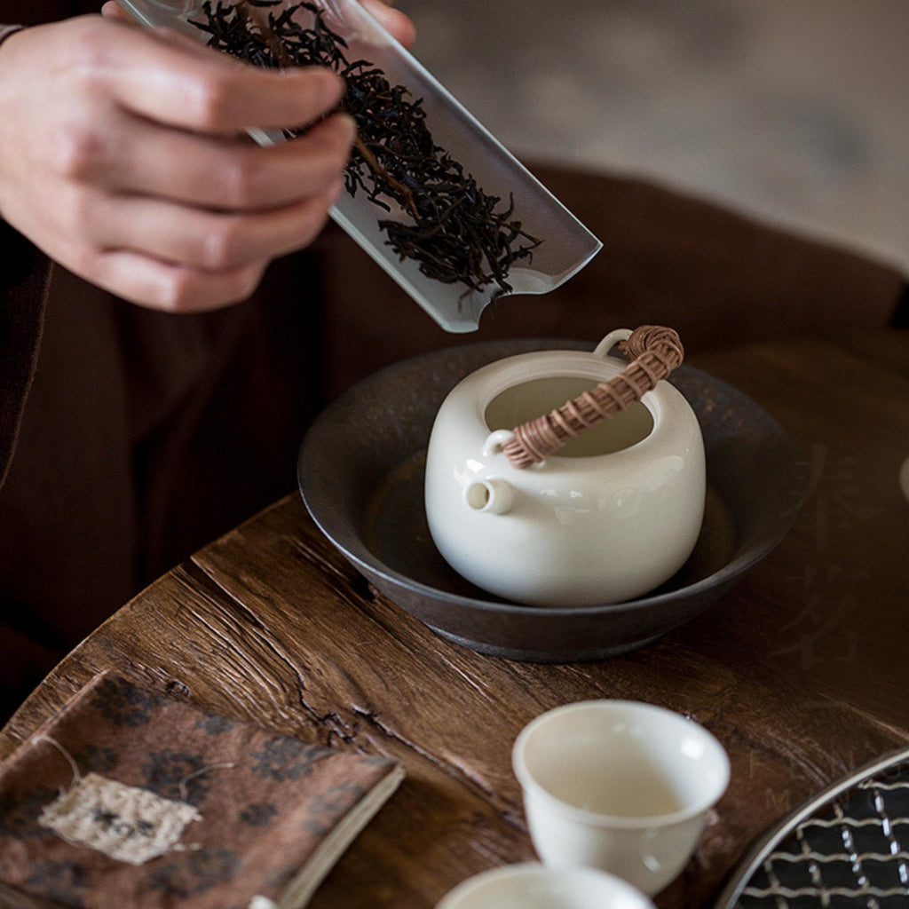 Rattan Handle Milky White Ceramic Kung Fu Teapot